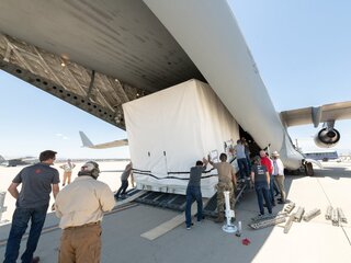 SWOT's scientific payload loading into a U.S. Air Force C-17 airplane for transport to Cannes, France.