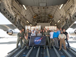 Team members who helped load the hardware onto a C-17 aircraft for SWOT's transfer from Southern, Calif. to Cannes France. 
