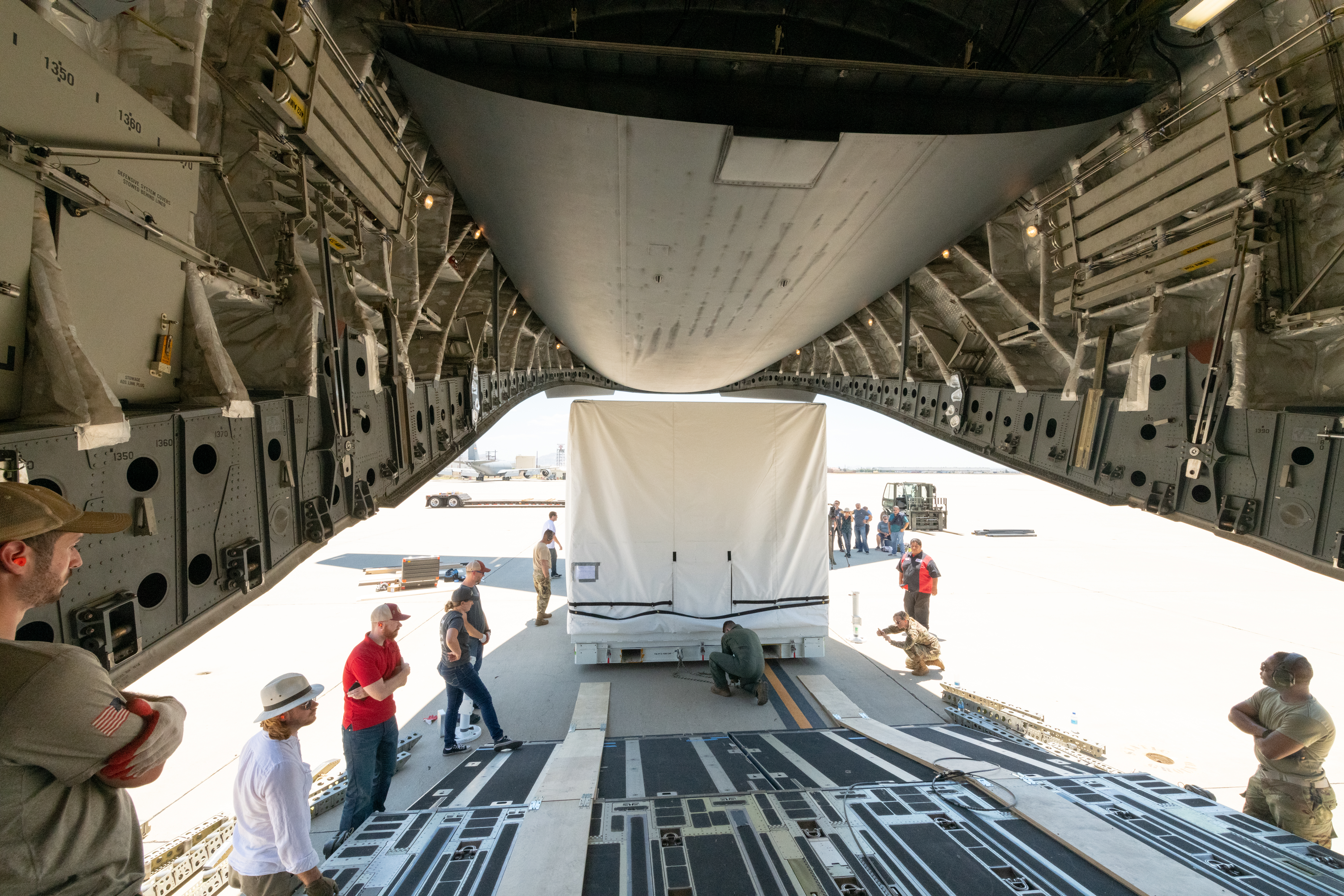 A view from inside the plane as the SWOT instrument is being loaded on.