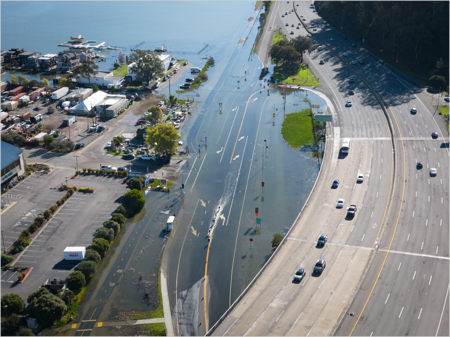  

An unusually high tide, called a King Tide, floods a highway on-ramp in Northern California in January 2023. Sea level rise and El Niños can exacerbate this type of flooding.

California King Tides Project
