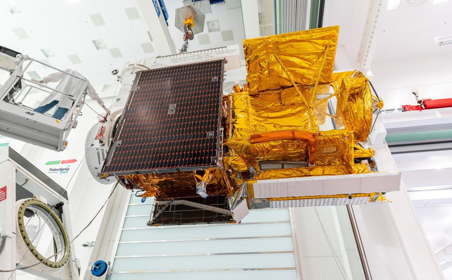 Workers in a clean room in Cannes, France, load the Surface Water and Ocean Topography (SWOT) satellite into a container in preparation for shipping the spacecraft to the U.S. Photo credit: CNES/Thales Alenia Space
