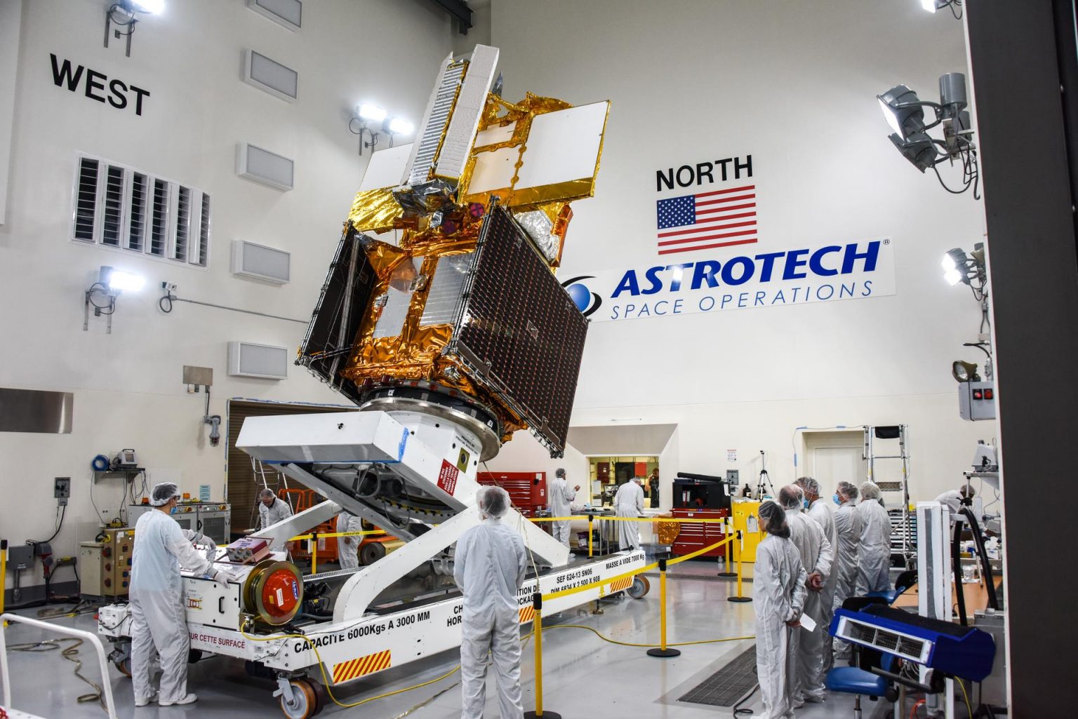 The Surface Water and Ocean Topography (SWOT) spacecraft is moved into a transport container inside the Astrotech facility at Vandenberg Space Force Base in California on Nov. 18, 2022. Photo credit: USSF 30th Space Wing/Chris Okula
