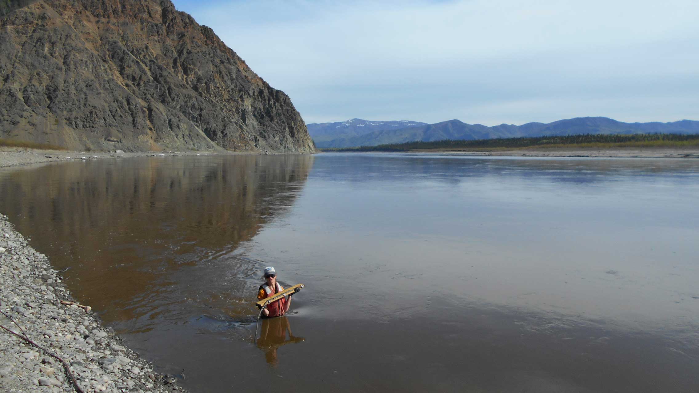 USGS hydrologist Heather Best places a water level sensor at a monitoring gauge in Alaska’s Yukon River. The state’s size, rugged terrain, and limited transportation infrastructure make traditional stream gauging cost prohibitive.

 Credit: Derek Frohbieter, North Carolina Association of Floodplain Managers
